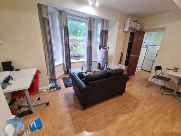 Bright and welcoming living room with ample nat...