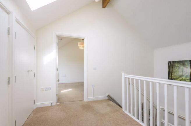 Landing with storage cupboards