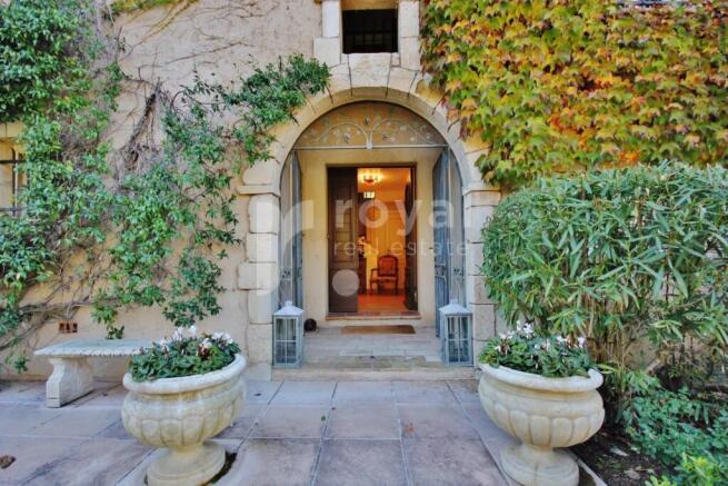 Elegant entrance with solid wood door in a luxury 