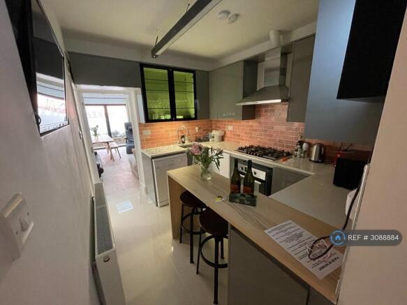 Kitchen Area With Under Stairs Toilet