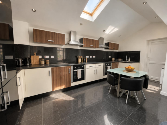 Sunlit Walnut and Black Kitchen.png