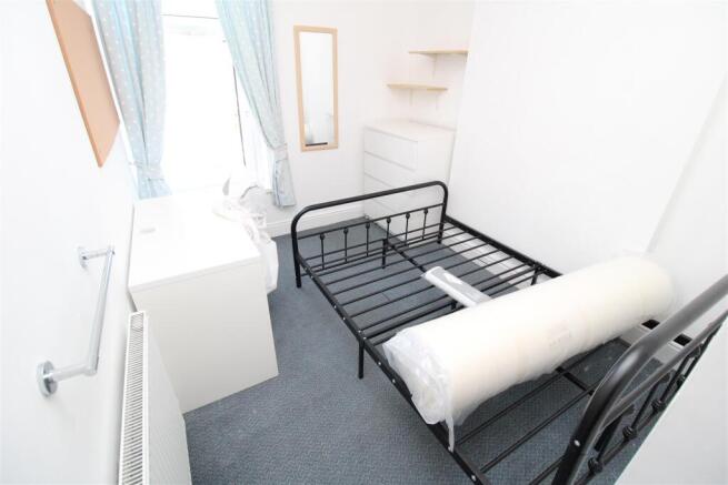 Bright bedroom with ample storage and desk...