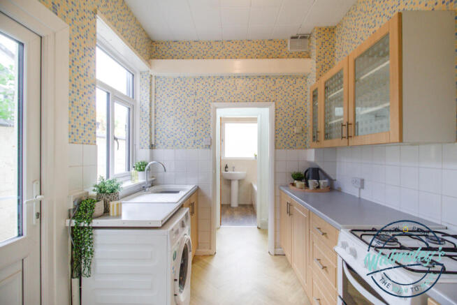 Kitchen with lobby towards bathroom