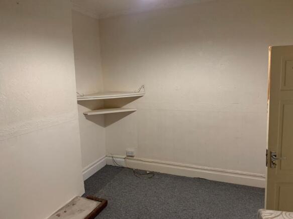 Bright bedroom corner with handy built-in stora...