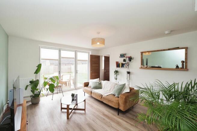 Generous and naturally light living with bi fold doors to the garden