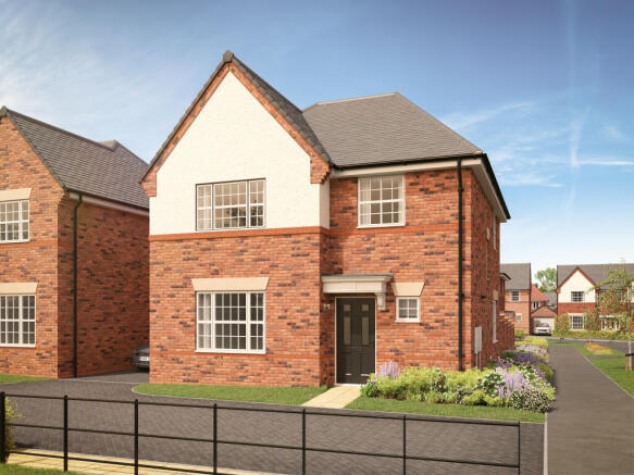 A modern brick house with a black front door and manicured flowerbeds sits behind a black metal fenc