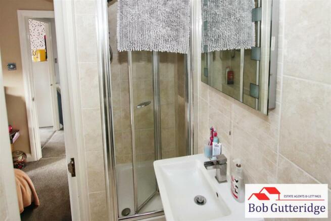 EN-SUITE SHOWER ROOM
