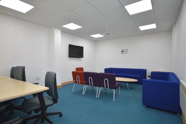 Spacious communal lounge with modern furniture...