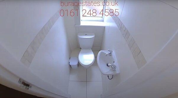 Compact, well-maintained WC with modern white f...