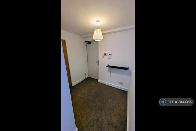 Hall.  Door On The Left Is To The Cupboard