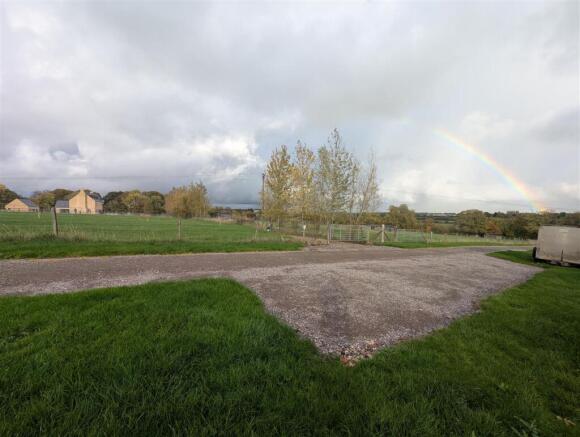 view of reversing area facing office field to nort