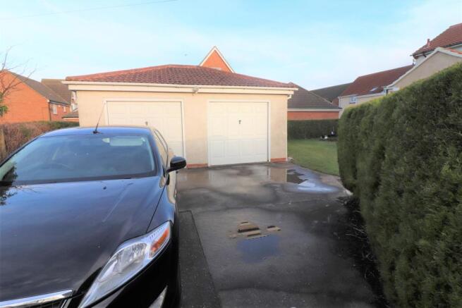 DOUBLE GARAGE AND DRIVE