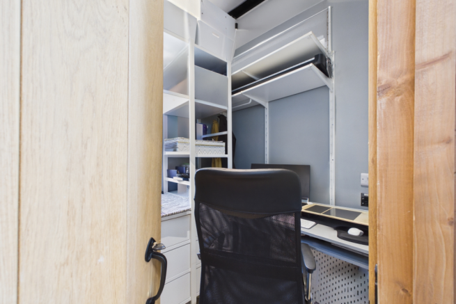 A fantastic space  as a walk in wardrobe or study 