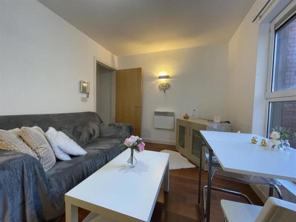 Cosy lounge with sleek dining area and sofa....