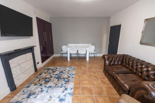 Spacious and contemporary living room featuring...