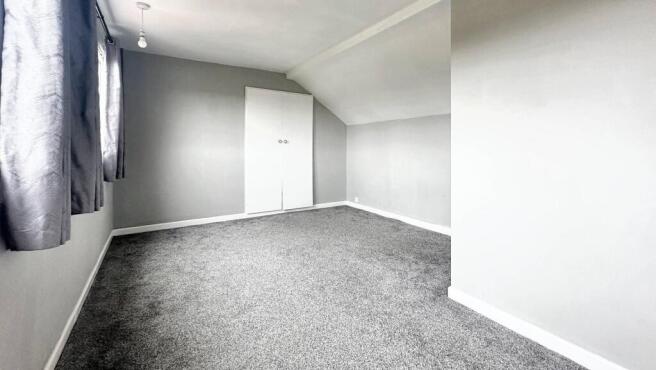 Bright and airy bedroom with modern grey carpet...