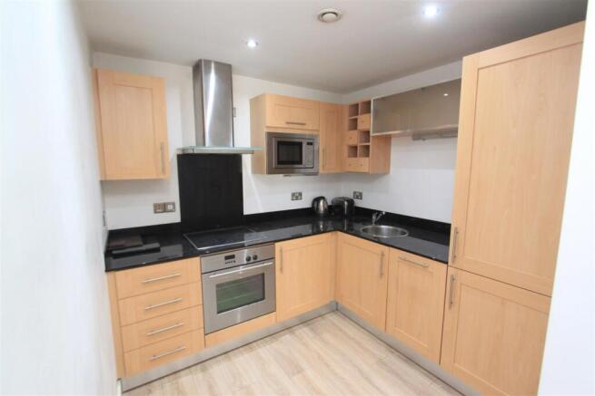 Sleek modern kitchen with integrated appliances...