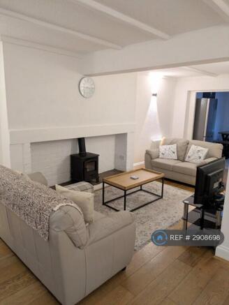 Living Room With Log Burning Fireplace