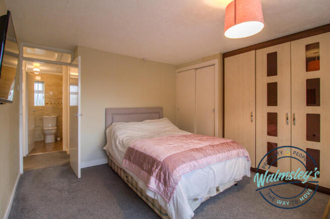 Double bedroom with fitted wardrobes & built in wa