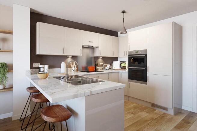 The kitchen features a breakfast bar to provide extra seating space