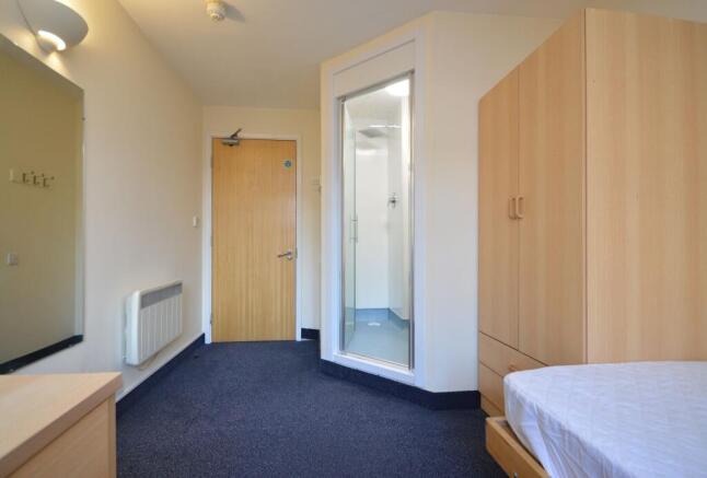 Compact room with ensuite shower and wardrobe...