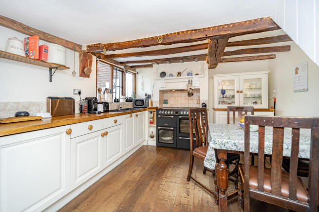 Kitchen / Dining room with beams and integrated appliances