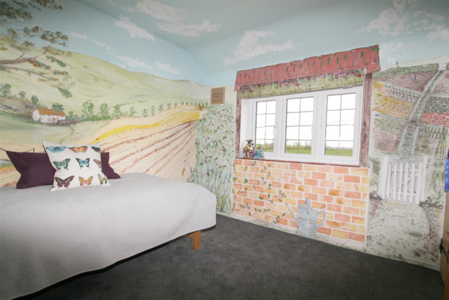 Bedroom with painted mural and countryside views.p