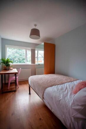 Bright room with cosy single bed and desk...