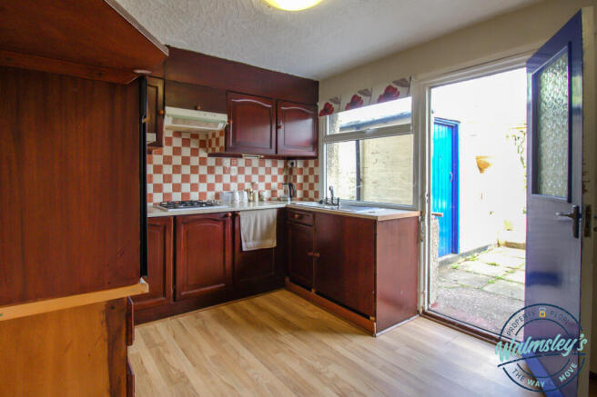 Kitchen with door to gardens