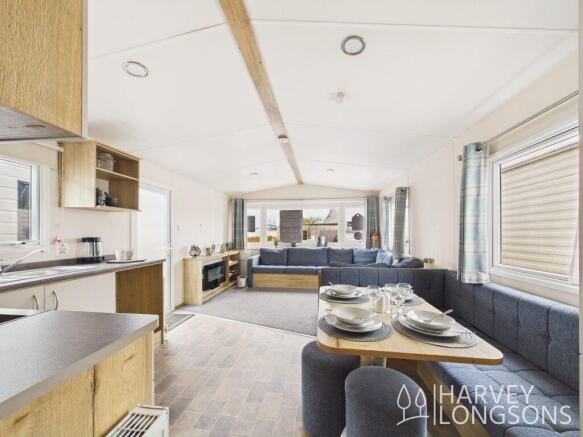 Open plan holiday home interior with lounge dining