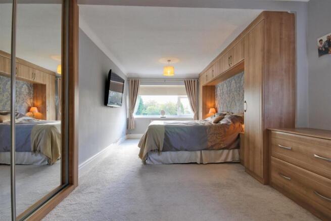 Bedroom One with fitted bedroom furniture