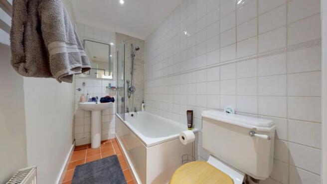 A clean and well-maintained bathroom featuring ...
