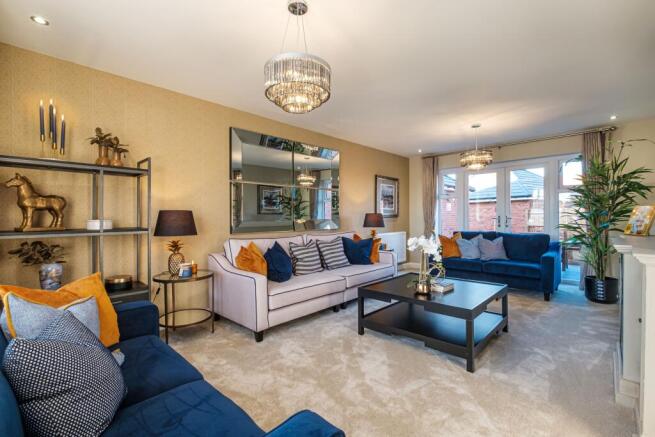 lounge with French doors to a garden at the far end