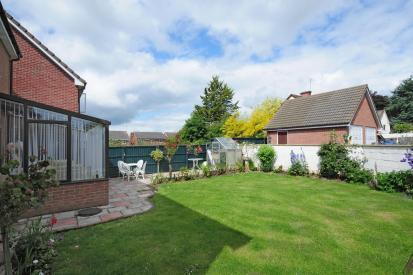 Rear Garden with garage beyond