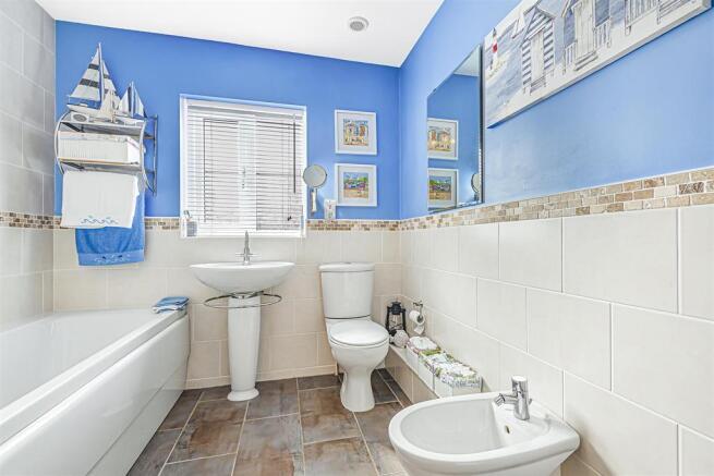 Bathroom with separate shower over