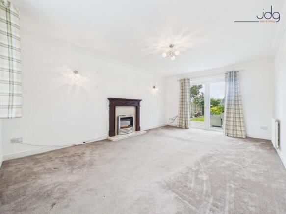 Living Room with electric fire and access to the garden