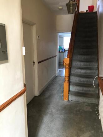 Welcoming hallway with ample space, leading to ...