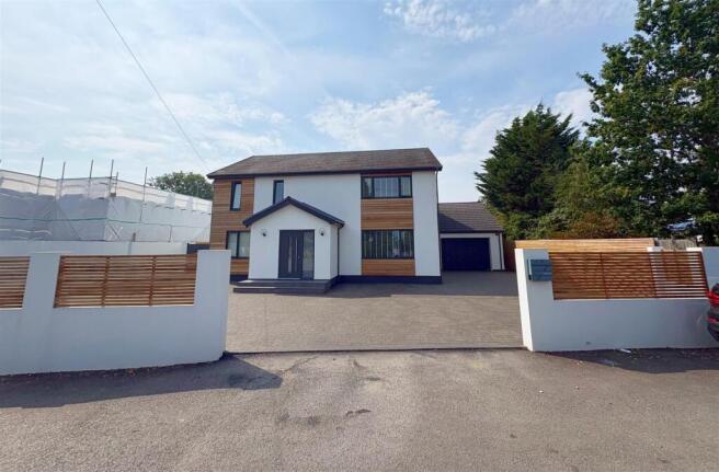 Front shot of property, garage and driveway (1).jp