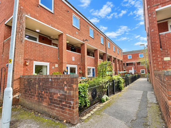 Red-Brick Courtyard Walkway in Blue Skies.png