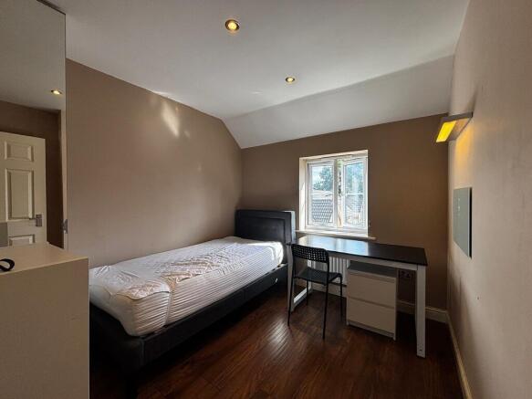 Cozy bedroom with study area and natural light...