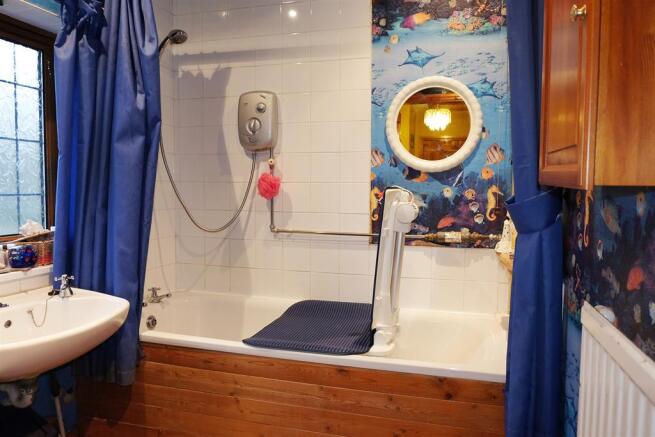 Bathroom with separate shower over