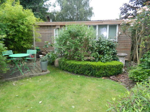 workshop with power at rear of garden