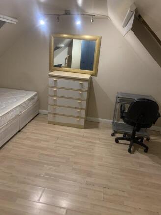 Bright bedroom with double bed and study desk...