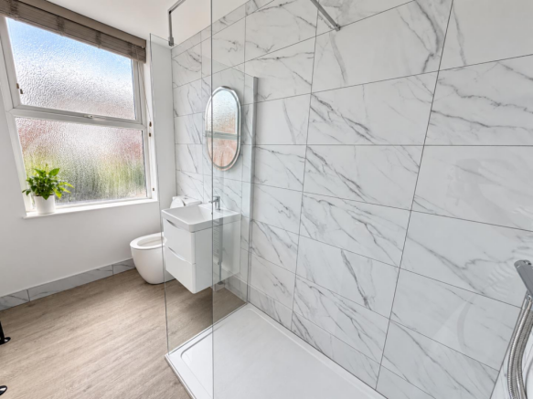 Bathroom window with leafy potted plant-5.png