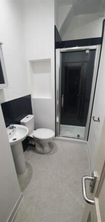 Bright, well-kept bathroom with a modern corner...