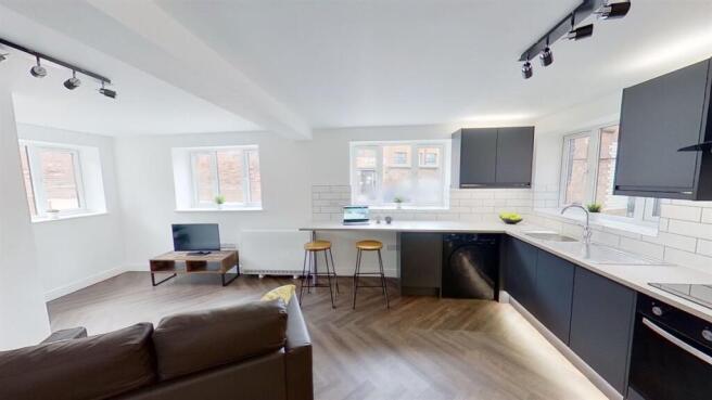 Modern open-plan kitchen with stylish finishes...