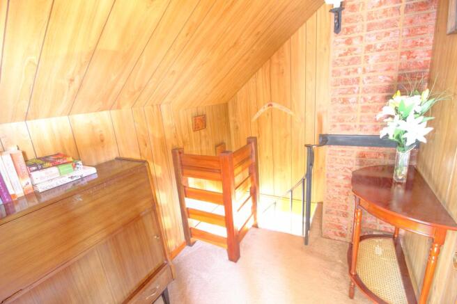 Landing to upstairs bedroom from spiral staircase