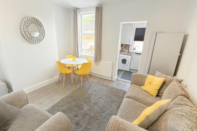 Bright and inviting living room featuring a com...