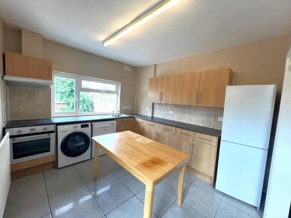 Bright, well-equipped kitchen with plenty of co...
