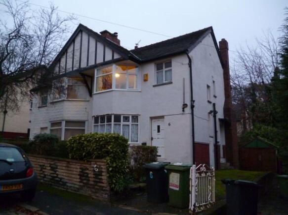 A charming front view of a traditional detached...